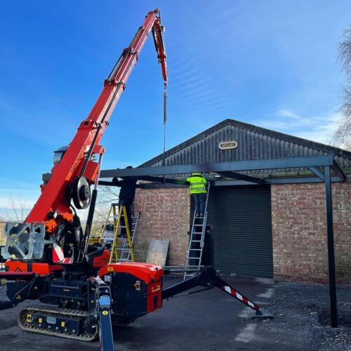 Farm building steels lifted into place