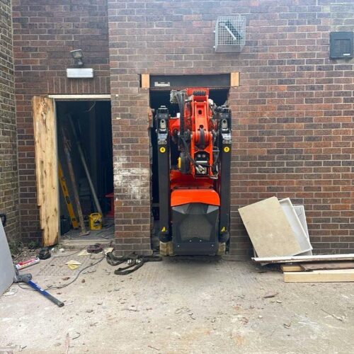 Jekko fitting through a doorway